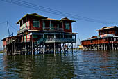 Inle Lake Myanmar. All the buildings are constructed on piles. Residents travel around by canoe, but there are also bamboo walkways and bridges over the canals, monasteries and stupas. 